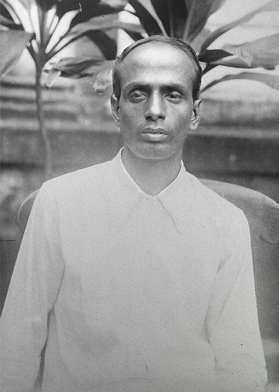 Archival photographic portrait of Surya Sen, seated outdoors in a plain collared shirt, taken before 1934.